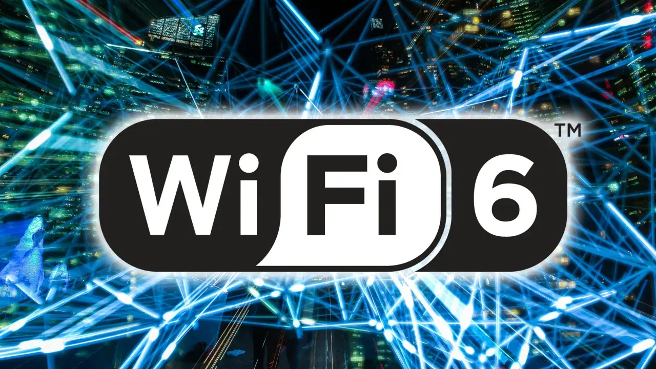 Logo Wi-Fi 6 na tle sieci światłowodów i miasta nocą.