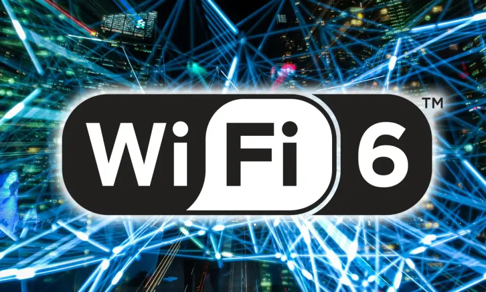 Logo Wi-Fi 6 na tle sieci światłowodów i miasta nocą.