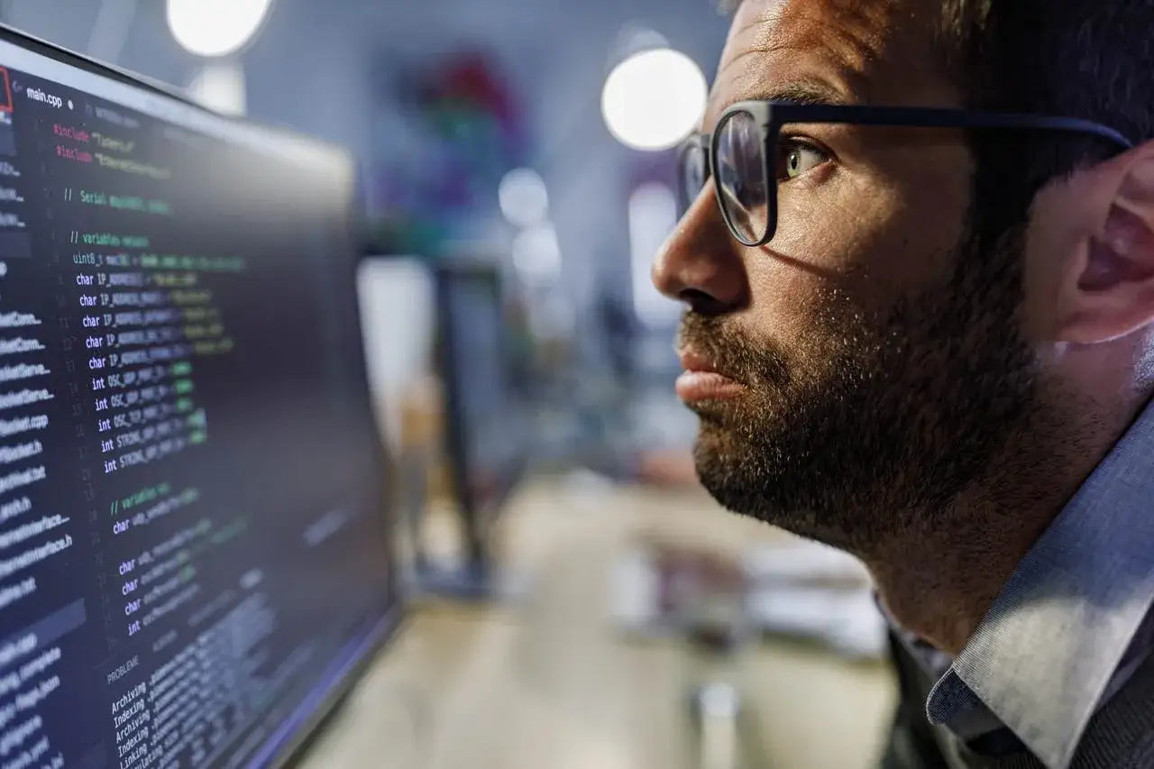 person confused looking at computer screen with code